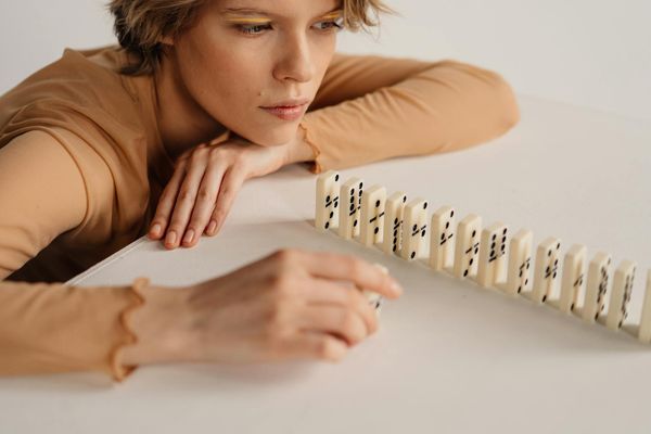 Close-up of a person's hands in a mindful gesture.